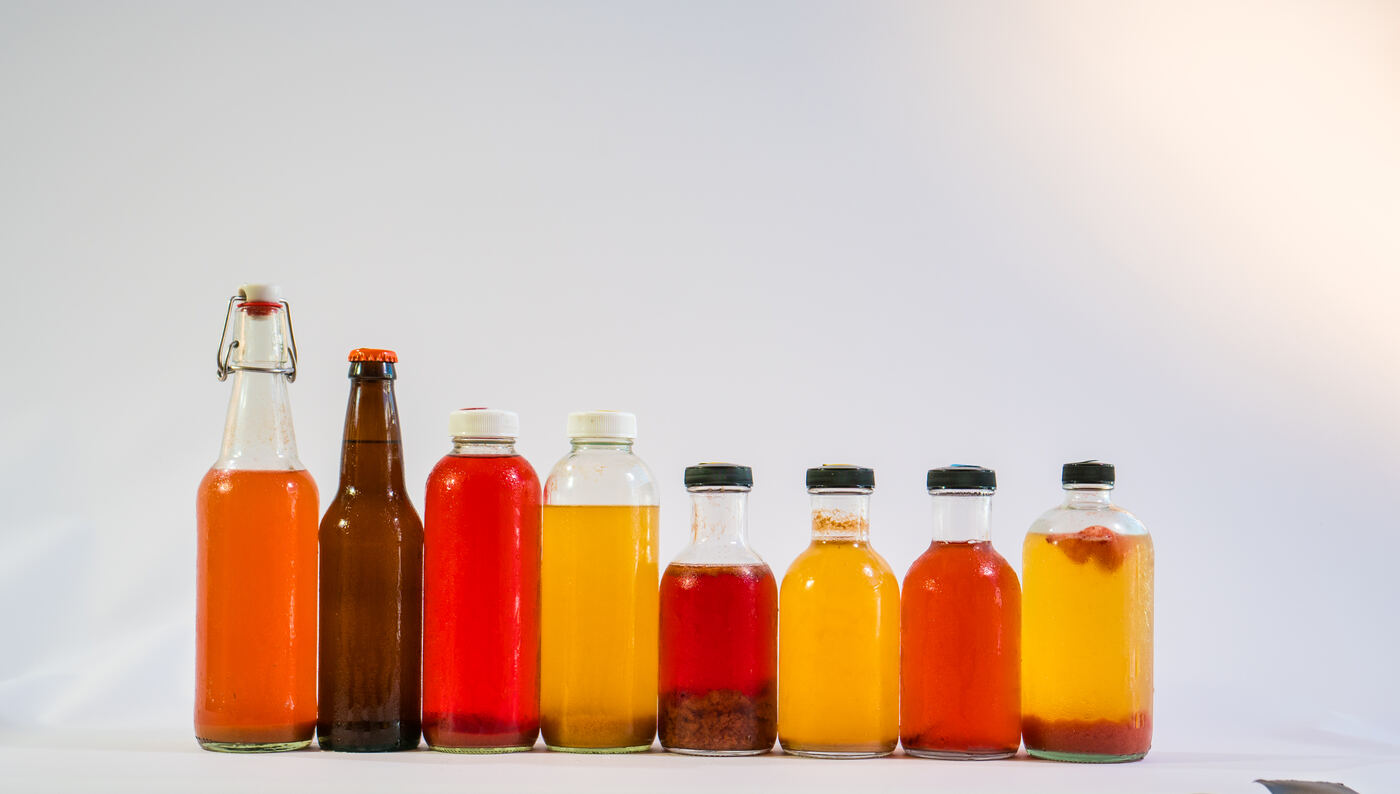 A colorful lineup of flavored kombucha bottles